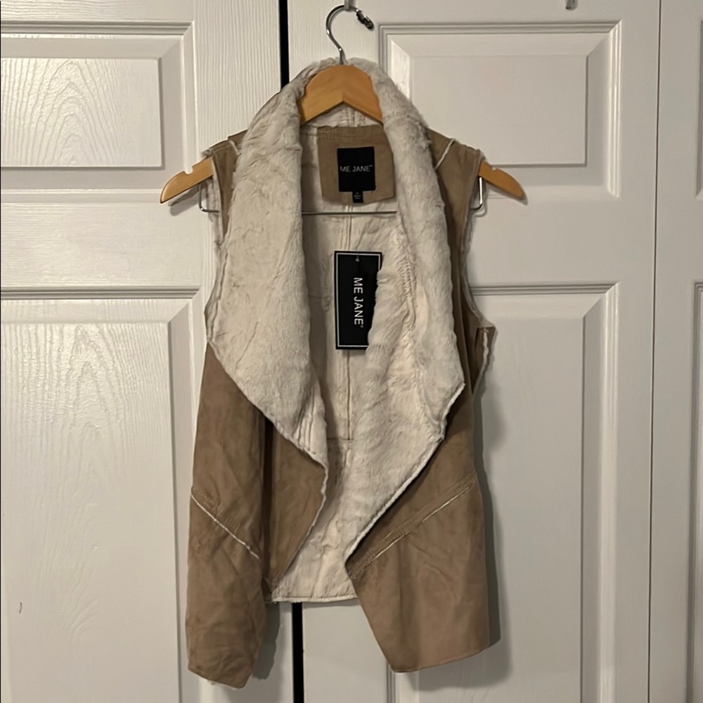 Faux fur vest. Brand new with tags never worn.